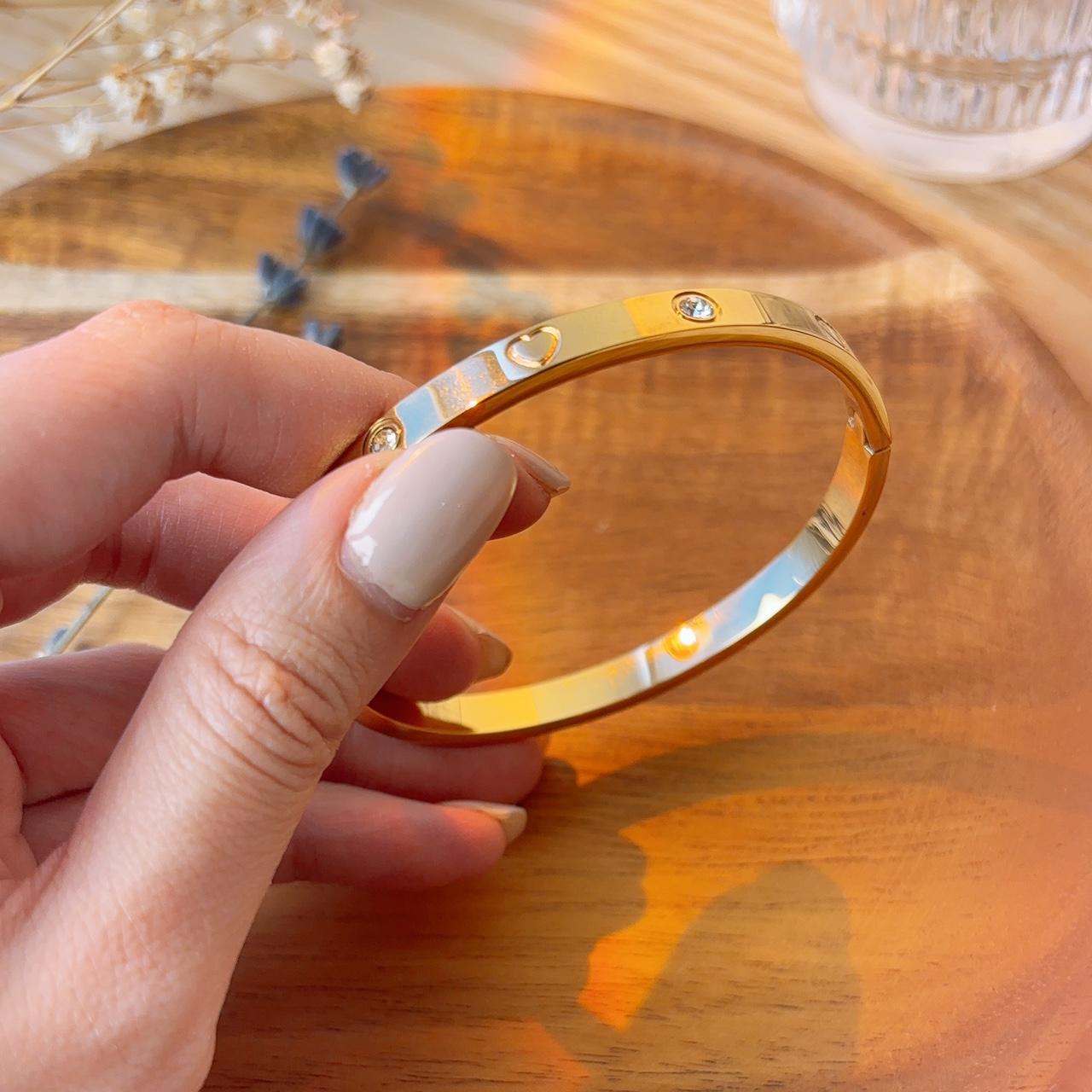 Heart engraved embellished gold bangle