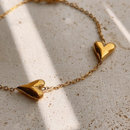 Trio heart gold bracelet