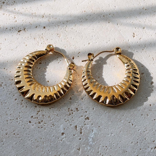 Sunburst engraved textured gold hoop earring